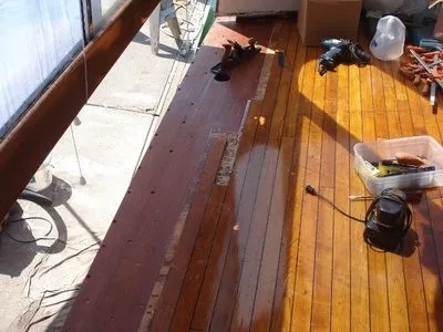 A wooden deck with a few tools on it