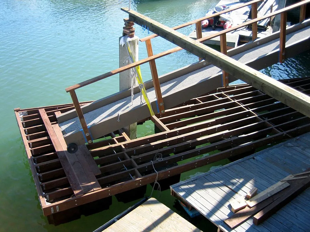 A wooden dock with stairs leading to the water