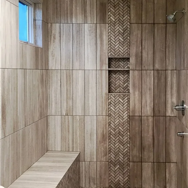 Wood-look porcelain tile shower with bench and built-in niches from a Richmond CA bathroom remodeling project Wood-look porcelain tile shower with bench and built-in niches from a Richmond CA bathroom remodeling project